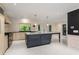 Spacious eat-in kitchen with marble island, bright white floors and stainless steel appliances at 2912 Vinings Forest Se Way, Atlanta, GA 30339