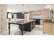 Bright, modern kitchen with large center island, tile backsplash and stainless steel appliances at 2912 Vinings Forest Se Way, Atlanta, GA 30339