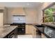 Gourmet kitchen featuring granite countertops, stainless steel range and tile backsplash at 2912 Vinings Forest Se Way, Atlanta, GA 30339