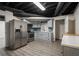 Basement kitchenette with stainless steel appliances and a modern blue backsplash at 2912 Vinings Forest Se Way, Atlanta, GA 30339