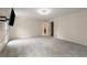 This main bedroom has neutral walls, new carpet, updated lighting and a TV mount at 2912 Vinings Forest Se Way, Atlanta, GA 30339