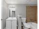 Bathroom featuring tile surround in the shower and tub area, neutral paint, and a single sink vanity at 6350 Mozart Dr, Riverdale, GA 30296