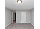 Bright bedroom with plush carpet, neutral paint and a window for natural light at 6350 Mozart Dr, Riverdale, GA 30296