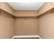 Walk in closet featuring neutral paint, shelving and a hanging rod at 6350 Mozart Dr, Riverdale, GA 30296