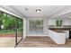 Bright dining area with modern flooring and sliding glass door at 6350 Mozart Dr, Riverdale, GA 30296