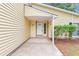 Close-up of home's entrance featuring a white door and complementary trim at 6350 Mozart Dr, Riverdale, GA 30296