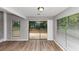 Sunlit living room with hardwood floors and views to the backyard at 6350 Mozart Dr, Riverdale, GA 30296