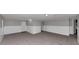 Living room features neutral carpeting and arched doorway at 6350 Mozart Dr, Riverdale, GA 30296