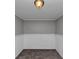 Small room featuring neutral carpeting and updated wall colors at 6350 Mozart Dr, Riverdale, GA 30296