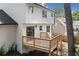 Wooden back deck with railing, accessed by double doors at 1489 Kolb Ridge Sw Dr, Marietta, GA 30008