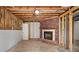 Unfinished basement area featuring a brick fireplace and ample space for customization at 1489 Kolb Ridge Sw Dr, Marietta, GA 30008