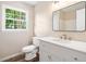 Bright bathroom features a large vanity, ample counter space, and large window at 1489 Kolb Ridge Sw Dr, Marietta, GA 30008