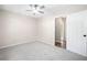 This bedroom features plush carpeting, a ceiling fan, and an ensuite bath/walk in closet at 1489 Kolb Ridge Sw Dr, Marietta, GA 30008