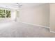 Large bedroom features soft neutral walls, plush gray carpeting, and large windows to view the landscape at 1489 Kolb Ridge Sw Dr, Marietta, GA 30008