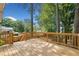 Spacious wooden deck offers ample space for outdoor living and entertaining with lush trees nearby at 1489 Kolb Ridge Sw Dr, Marietta, GA 30008