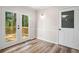 Bright dining area featuring wood floors and double doors to outdoor deck at 1489 Kolb Ridge Sw Dr, Marietta, GA 30008