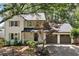 Charming two-story home features a welcoming front porch and attached two-car garage at 1489 Kolb Ridge Sw Dr, Marietta, GA 30008