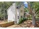 Side view of a two-story home with a well-manicured lawn and mature trees at 1489 Kolb Ridge Sw Dr, Marietta, GA 30008