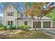 Two-story home with a two-car garage and a well-manicured front yard at 1489 Kolb Ridge Sw Dr, Marietta, GA 30008