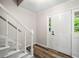 Light-filled foyer with staircase and front door with sidelight window at 1489 Kolb Ridge Sw Dr, Marietta, GA 30008