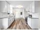 Bright kitchen featuring white cabinets, granite countertops, and stainless steel appliances at 1489 Kolb Ridge Sw Dr, Marietta, GA 30008