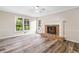 Inviting living room with hardwood floors and a charming brick fireplace at 1489 Kolb Ridge Sw Dr, Marietta, GA 30008