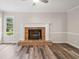 Cozy living room featuring a classic brick fireplace and natural light at 1489 Kolb Ridge Sw Dr, Marietta, GA 30008