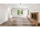 Charming living room with hardwood floors, a brick fireplace, and lots of light at 1489 Kolb Ridge Sw Dr, Marietta, GA 30008