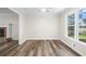 Open living room featuring hardwood floors, natural light, and view of the yard at 1489 Kolb Ridge Sw Dr, Marietta, GA 30008