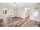 Bright living room with hardwood floors, and view into the modern kitchen at 1489 Kolb Ridge Sw Dr, Marietta, GA 30008