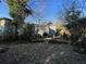 Shows the backyard with overgrown vegetation and debris at 158 Milton Sw Ave, Atlanta, GA 30314