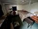 A small bedroom showing worn furniture and poor condition at 158 Milton Sw Ave, Atlanta, GA 30314