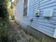 Shows a side view of the home's exterior with weathered siding at 158 Milton Sw Ave, Atlanta, GA 30314