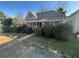 Quaint single-story home with a traditional design and landscaped front yard at 158 Milton Sw Ave, Atlanta, GA 30314