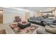 Finished basement with comfortable seating, decorative rug, and open floor plan at 210 Little River Farms Trl, Canton, GA 30115