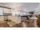 Open basement featuring a kitchen, pool table, and comfortable seating area at 210 Little River Farms Trl, Canton, GA 30115