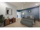 Comfortable bedroom with ceiling fan, blue accent wall, bedside tables, and framed wall art at 210 Little River Farms Trl, Canton, GA 30115