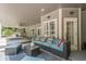 Inviting covered patio featuring stylish outdoor furniture and ample space for relaxing and entertaining at 210 Little River Farms Trl, Canton, GA 30115