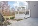 Outdoor deck and backyard space surrounded by lush greenery and a wooded area, offering privacy at 210 Little River Farms Trl, Canton, GA 30115