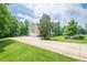 Long driveway leading to a beautiful home with lush landscaping and attached garage at 210 Little River Farms Trl, Canton, GA 30115
