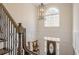 Bright foyer with staircase, arched window, and decorative front door at 210 Little River Farms Trl, Canton, GA 30115