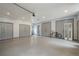 Spacious garage with multiple doors, ample storage, and a clean, well-lit area at 210 Little River Farms Trl, Canton, GA 30115