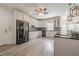 Spacious kitchen with modern appliances, white cabinetry, and granite countertops at 210 Little River Farms Trl, Canton, GA 30115