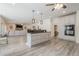 Open floor plan featuring a kitchen island with granite countertops and stainless appliances at 210 Little River Farms Trl, Canton, GA 30115