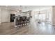 Eat-in kitchen with granite countertop seating, stainless appliances, and bright light from many windows at 210 Little River Farms Trl, Canton, GA 30115
