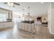 Open concept kitchen with island, modern appliances, and connected living space at 210 Little River Farms Trl, Canton, GA 30115