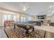 Open living space with a billiard table, dining area, media center and comfortable seating at 210 Little River Farms Trl, Canton, GA 30115
