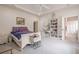Spacious main bedroom with tray ceilings, a cozy sitting area, and access to an en-suite bathroom at 210 Little River Farms Trl, Canton, GA 30115
