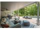 Spacious outdoor patio with stylish seating, a swing, and views of the pool at 210 Little River Farms Trl, Canton, GA 30115