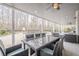 A covered patio that features a table, chairs, and seating, with pool views at 210 Little River Farms Trl, Canton, GA 30115